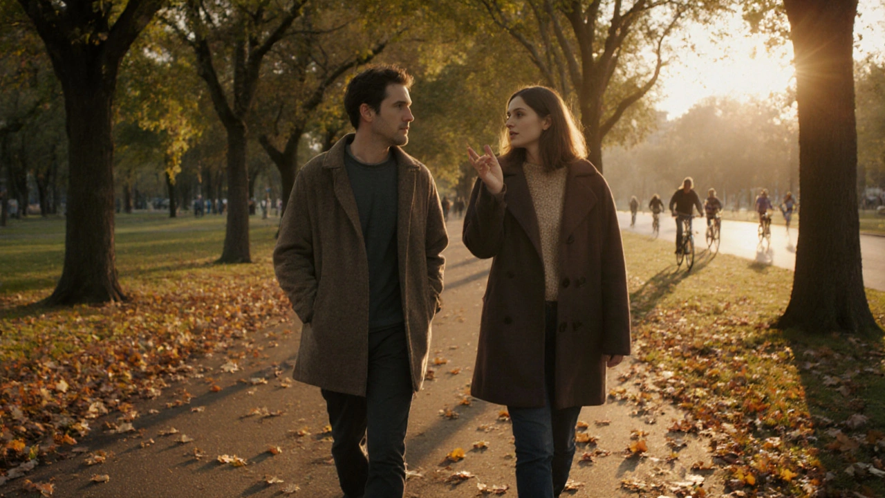 A man and woman walking peacefully together through Victoria Park during golden hour.