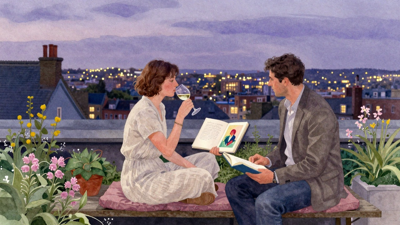 A couple relaxes on a rooftop garden at twilight, talking beside an open art book with city lights in the background.