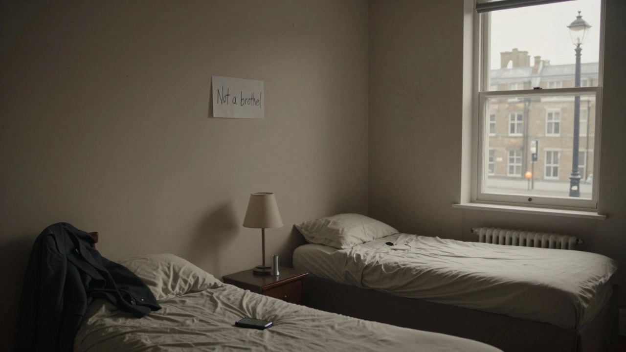 An empty London flat with two beds and a note on the wall, conveying the legal ambiguity of sex work.